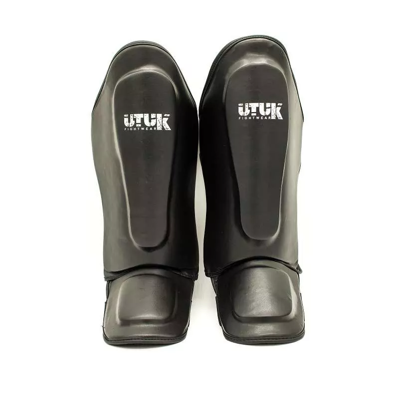Protège-tibias Utuk Enfant Noir Bianco 1 Protège-tibias Utuk Enfant Noir Bianco